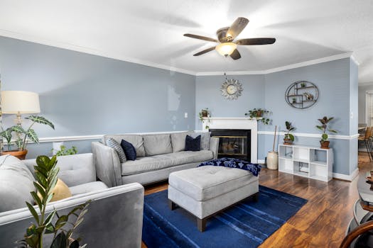 Stylish living room interior with blue decor and comfortable furniture.