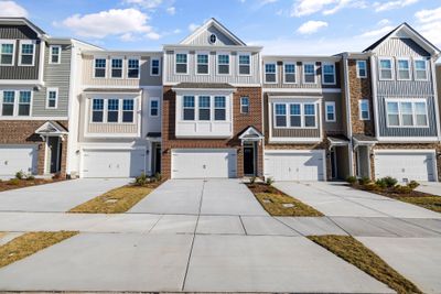 Row of modern townhouses, by Curtis Adams on Pexels
