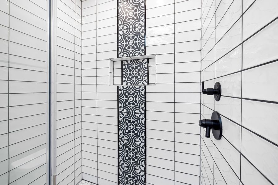 Geometric patterned tile in a shower area