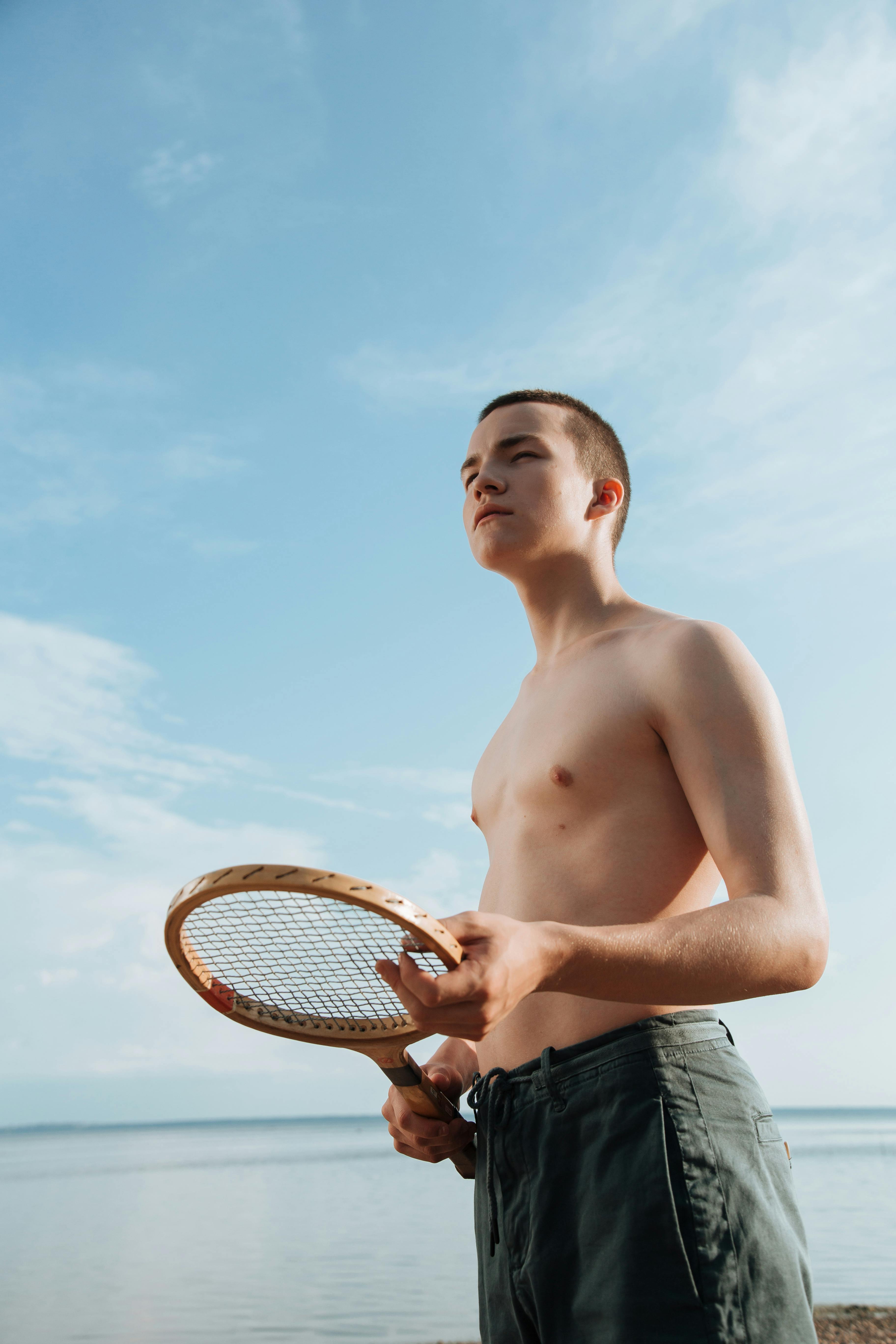 Boys Walking Half Naked on the Beach · Free Stock Photo