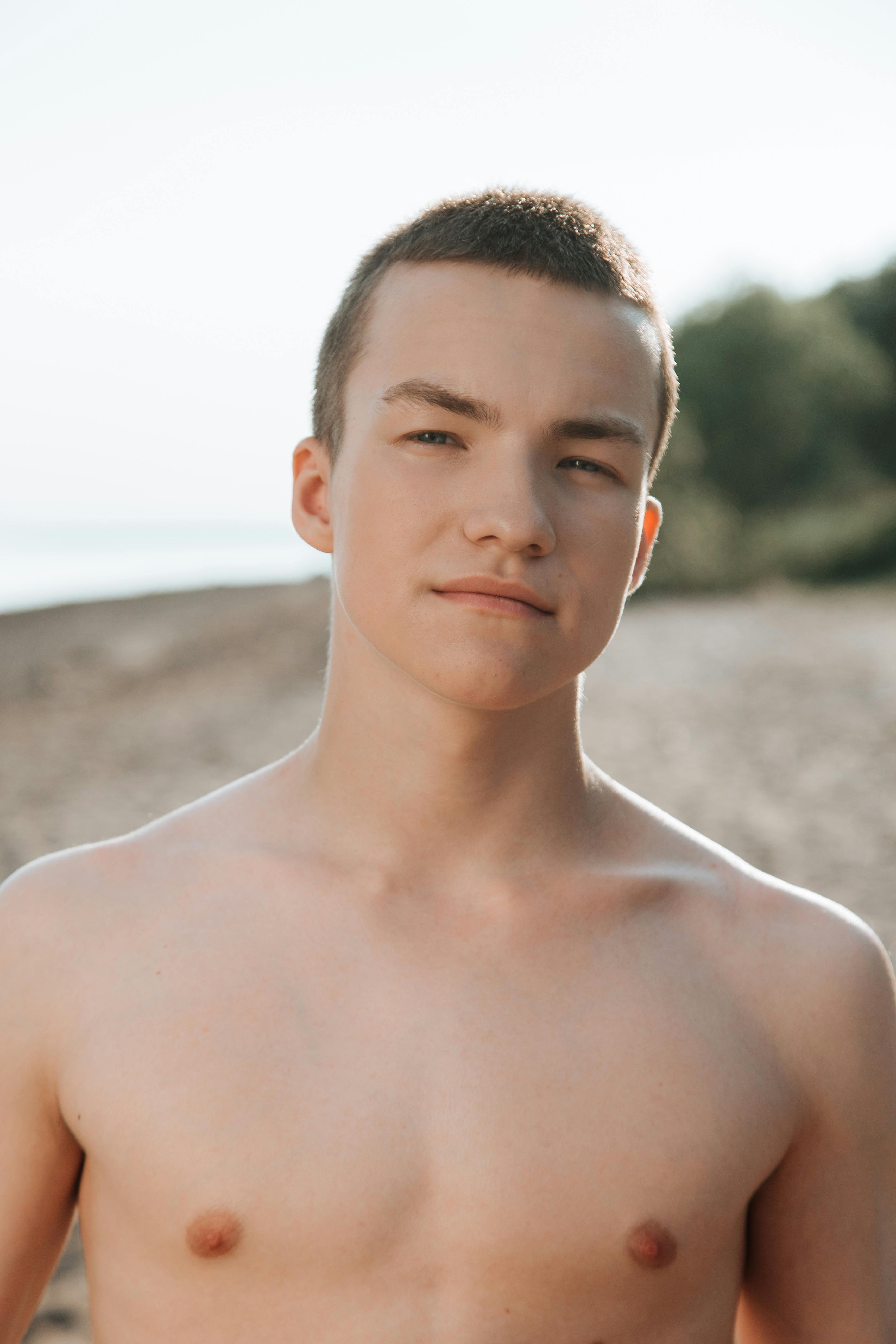 Boys Walking Half Naked on the Beach · Free Stock Photo