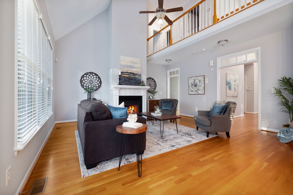 Staged living room with a fireplace, prepared for listing photography