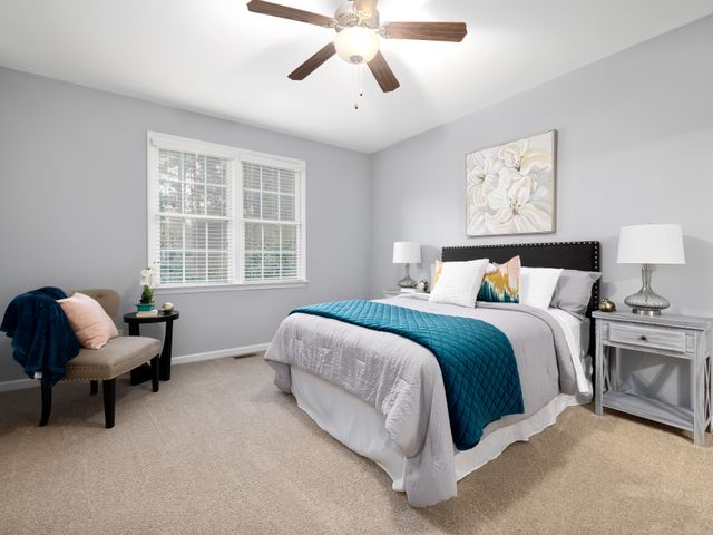 Bedroom ceiling area for smoke alarm placement Bedroom with a smooth ceiling and carpeted floor where alarms are placed
