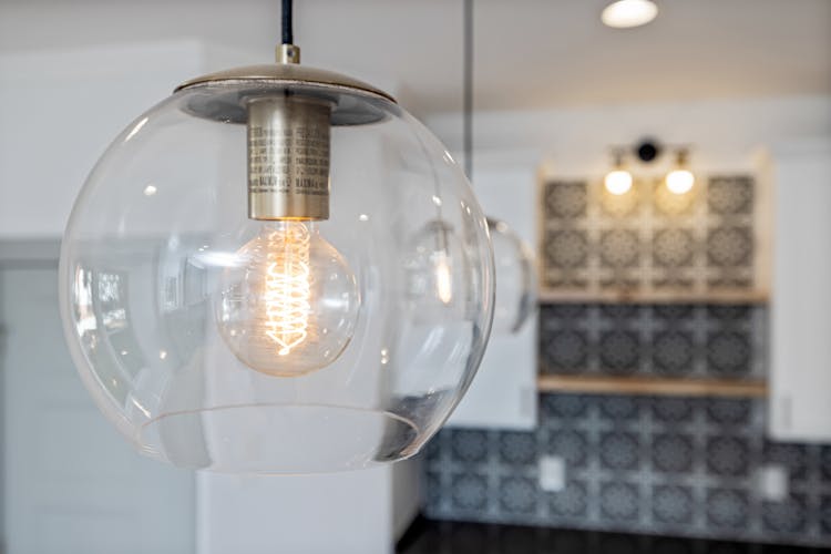 Light Bulb In Glass Lamp On Ceiling