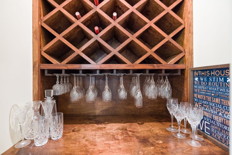 Mounted Wine Glass Rack DIY home decor project — A stylish indoor wine rack with hanging glasses, showcasing elegant wine storage.