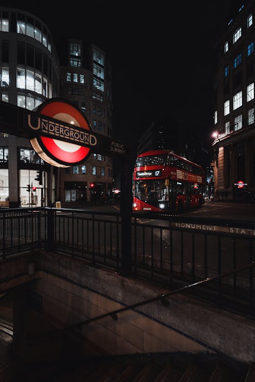 Red Bus on the Road During Night Time