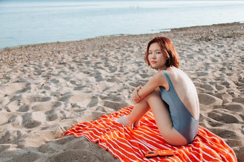 Woman Sitting on Beach