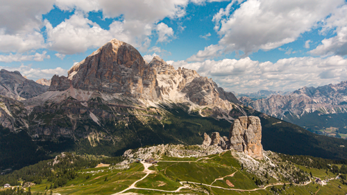 Free Stunning panoramic view of the Dolomites in Veneto, Italy, with rocky peaks under a cloudy sky. Stock Photo