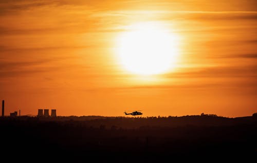 Free Silhouette of a Flying Helicopter Stock Photo