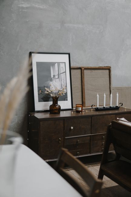 Stylish minimalist interior featuring artistic decor and vintage furniture in a modern home.