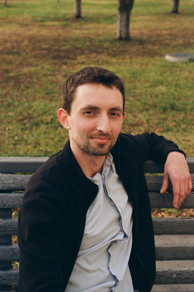 Handsome Man Sitting On Bench