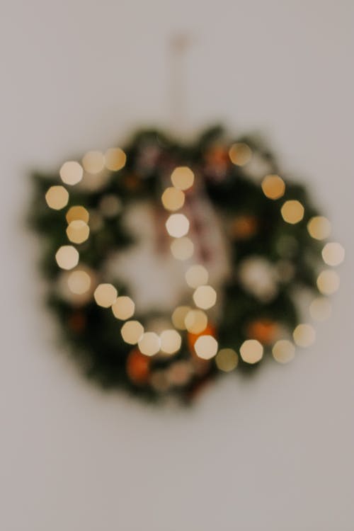 A Blurred Photo of a Christmas Wreath with Lights