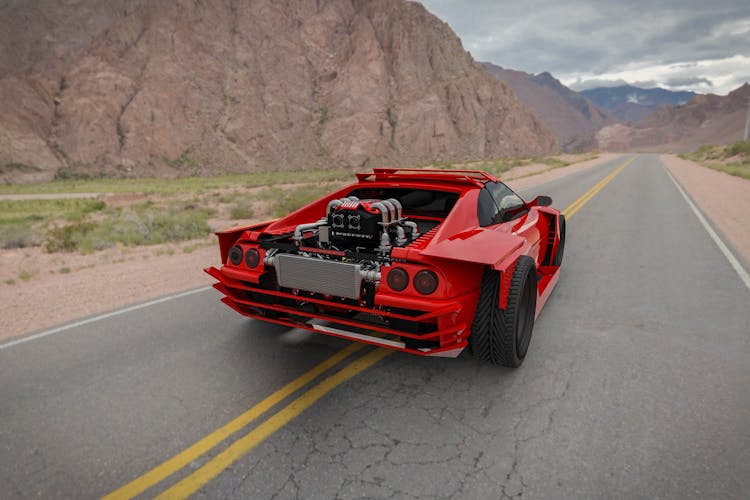 A Red Sports Car On The Road