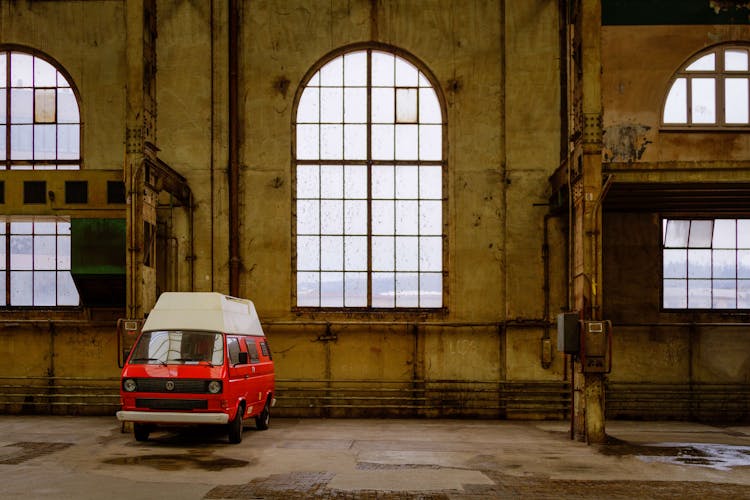 Red Van Parked Inside A Building