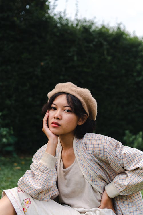 Woman in White Knit Sweater and Brown Hat