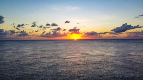 Free Serene sunset over the ocean in Cozumel, capturing vibrant colors and peaceful scenery. Stock Photo