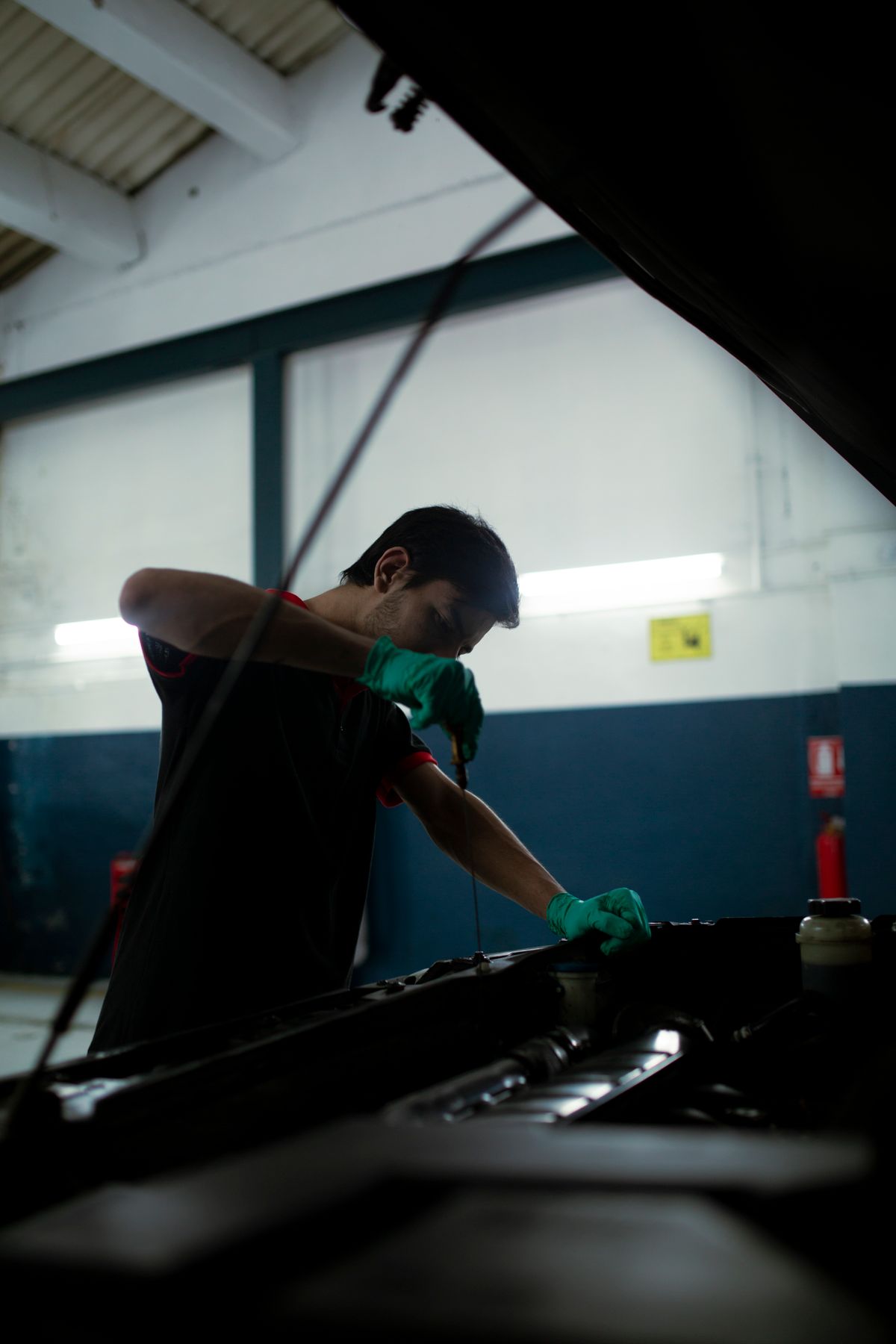 Prem Diagnostics technician checking a car engine