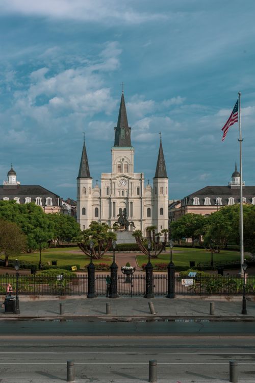 Free Historic St. Louis Cathedral in Jackson Square, New Orleans, under a clear blue sky. Stock Photo