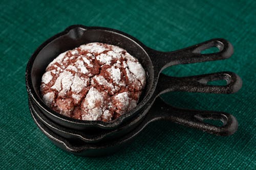 Free Black Cast Iron Pan with Chocolate Crinkle Cookie  Stock Photo
