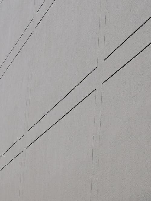 Free A Gray Concrete Wall with Lines Pattern Stock Photo