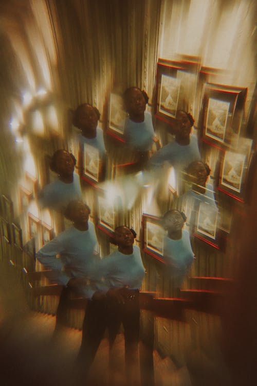 Photograph of Woman Standing on Stairs at Home with Multiplication Visual Effect