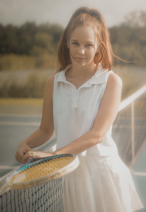 A Young Woman Holding a Tennis Racket