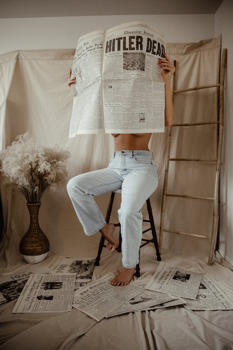 A Person Holding A Newspaper