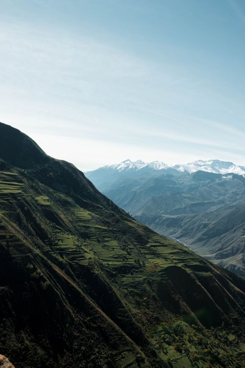 Free Breathtaking view of snowy mountains and lush valleys in Dagestan, Russia. Stock Photo