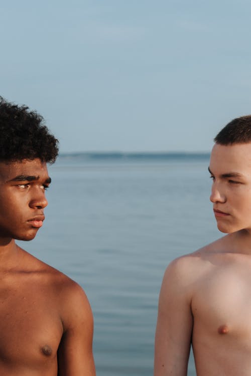 Free Topless Men Looking at Each Other  Stock Photo