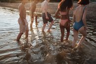 Teenagers Walking out of Water