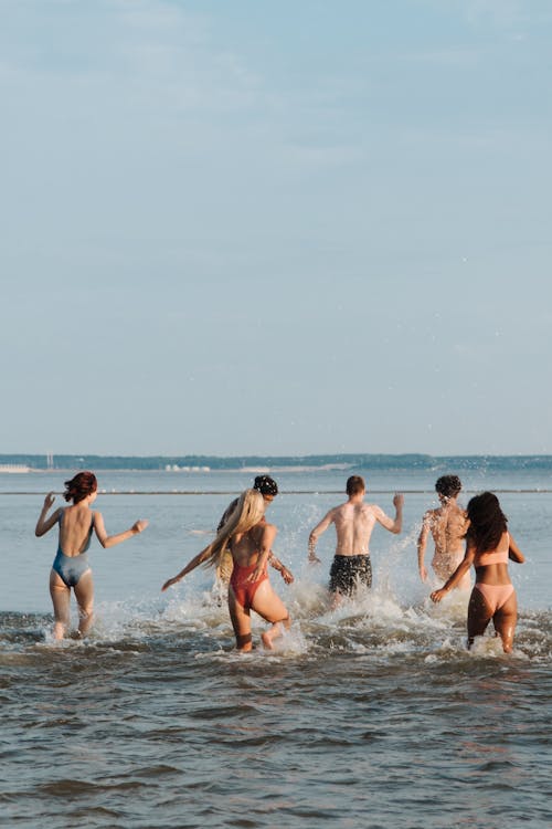 Teenagers on Vacation Playing in Water