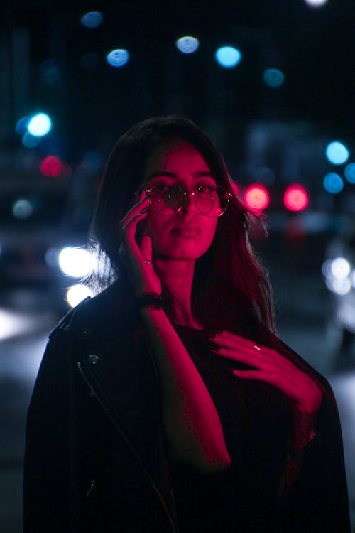 Woman Touching her Eyeglasses