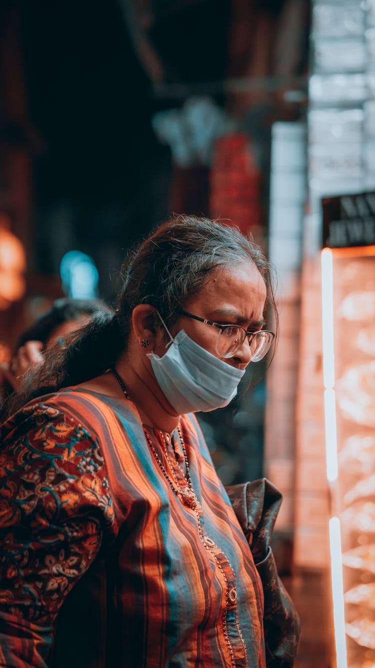 Side View Of An Elderly Woman In A Face Mask