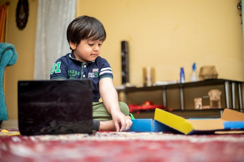 A Boy Sitting on the Floor