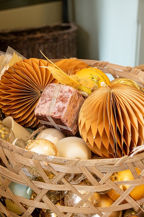 Assorted Christmas Ornaments in a Wicker Basket