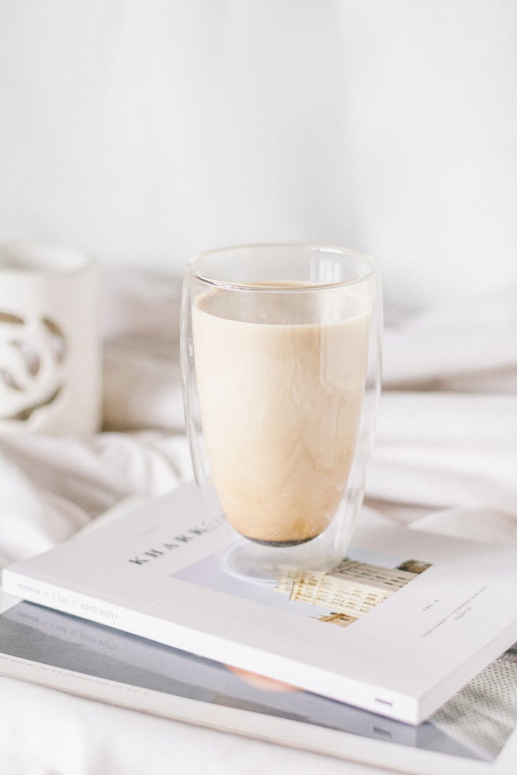 Morning Latte In Thermo Insulating Glass Standing On Stack Of Books 