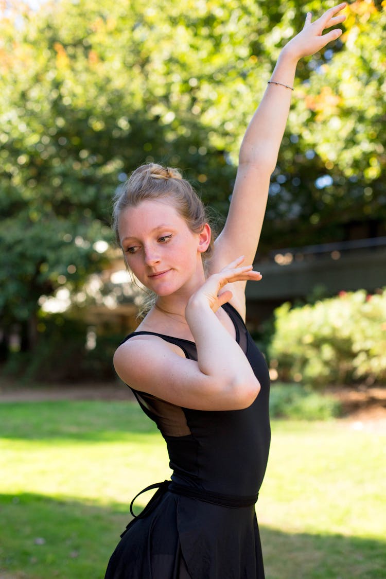 Girl Making A Ballet Pose In A Park