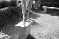 Grayscale Photo of Woman in White Dress