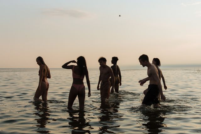 Ivy and the others wade into the shallows on the first evening at Tidewater Cove — photo by Ron Lach on Pexels