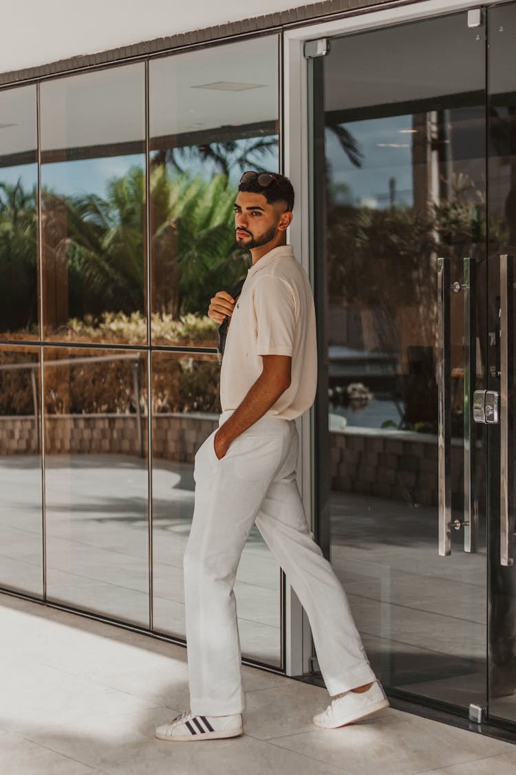 Young Bearded Man Walking Out Office Building