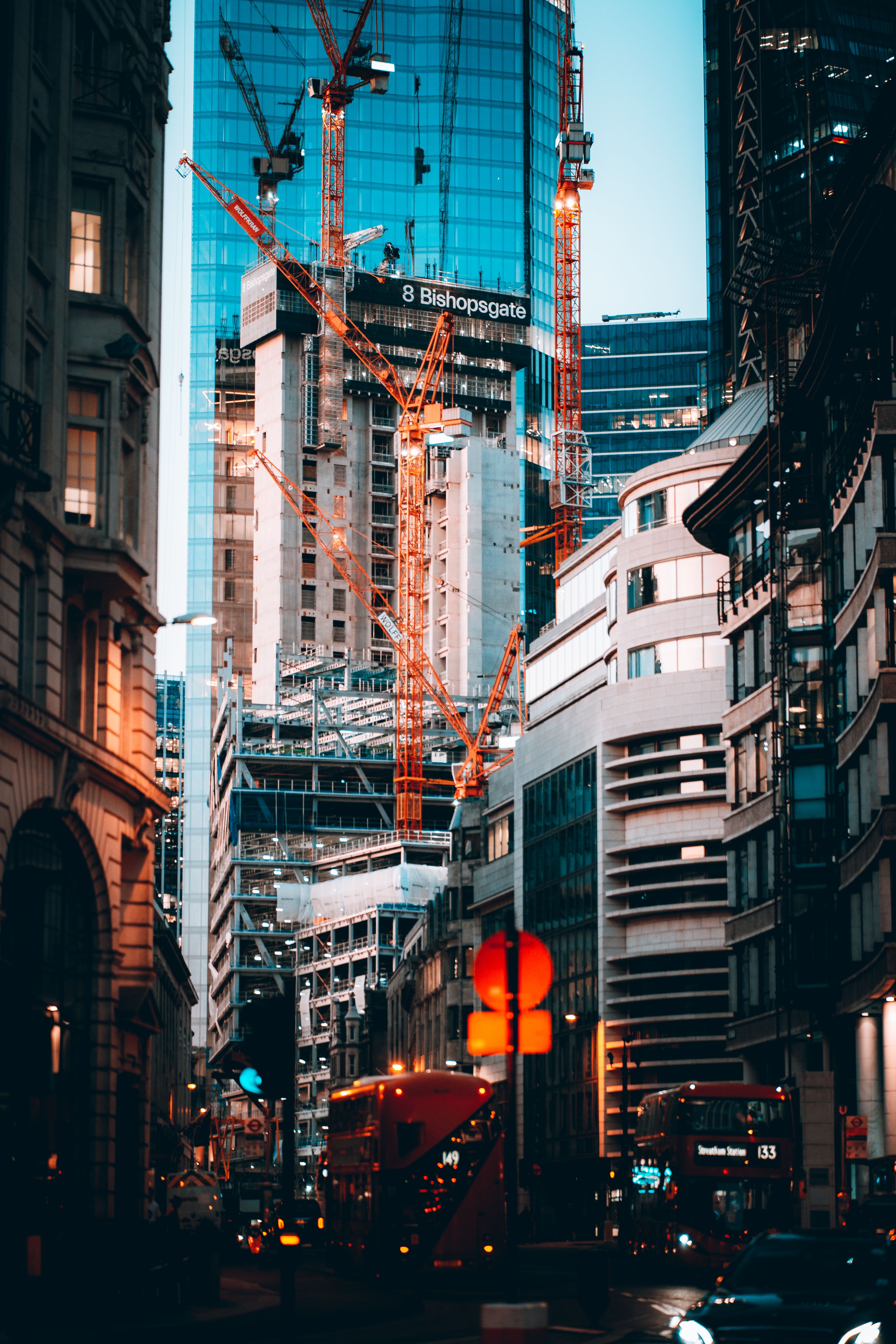 Cars on Road in Between High Rise Buildings · Free Stock Photo