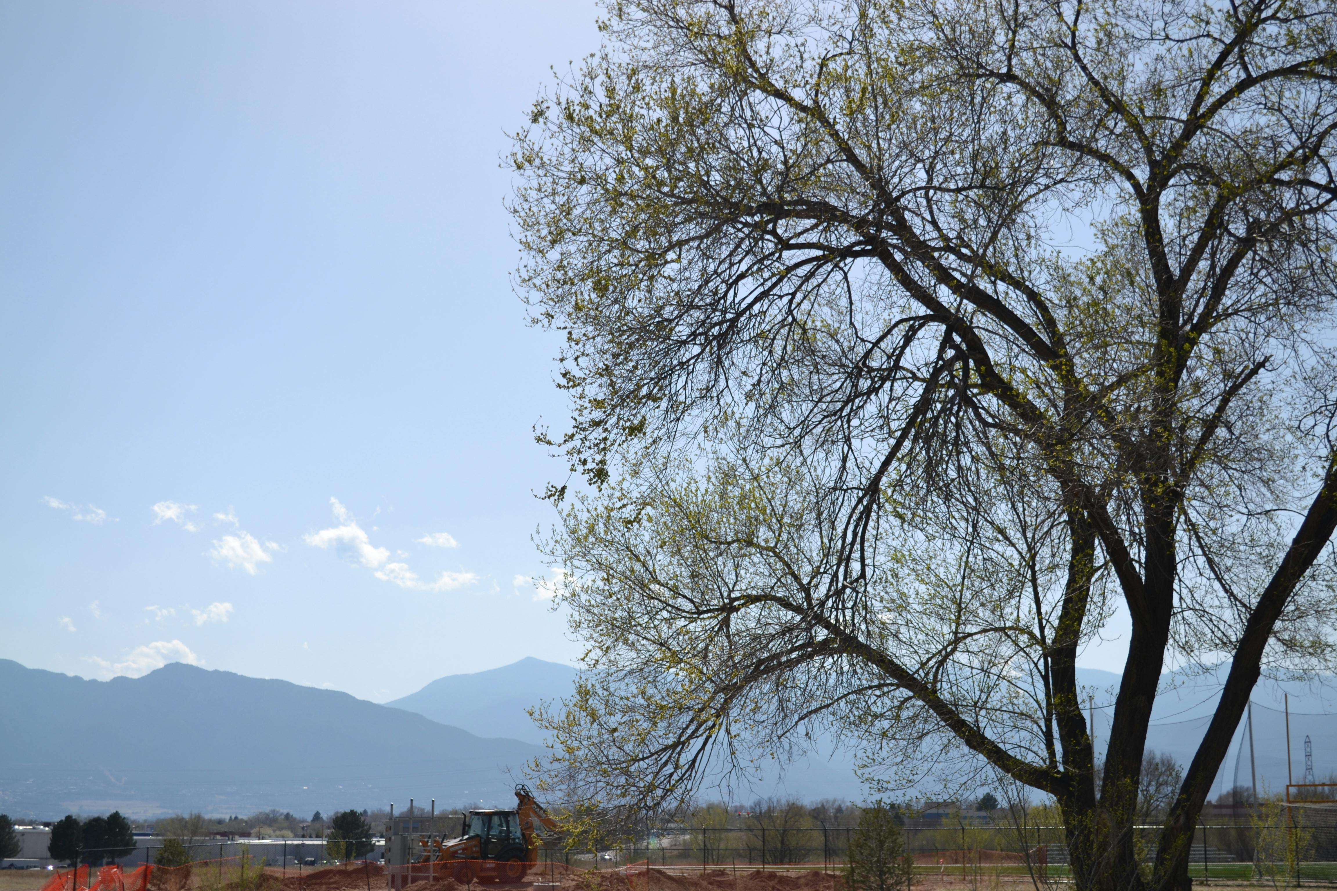 Sensual close-up of hands gently touching a woman's body in intimate embrace, artistic moody lighting