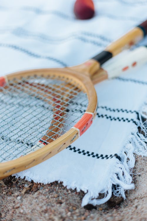 Free Badminton Rackets and a Ball on a Blanket Stock Photo