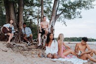 Teenage Friends Relaxing on the Beach by the Sea