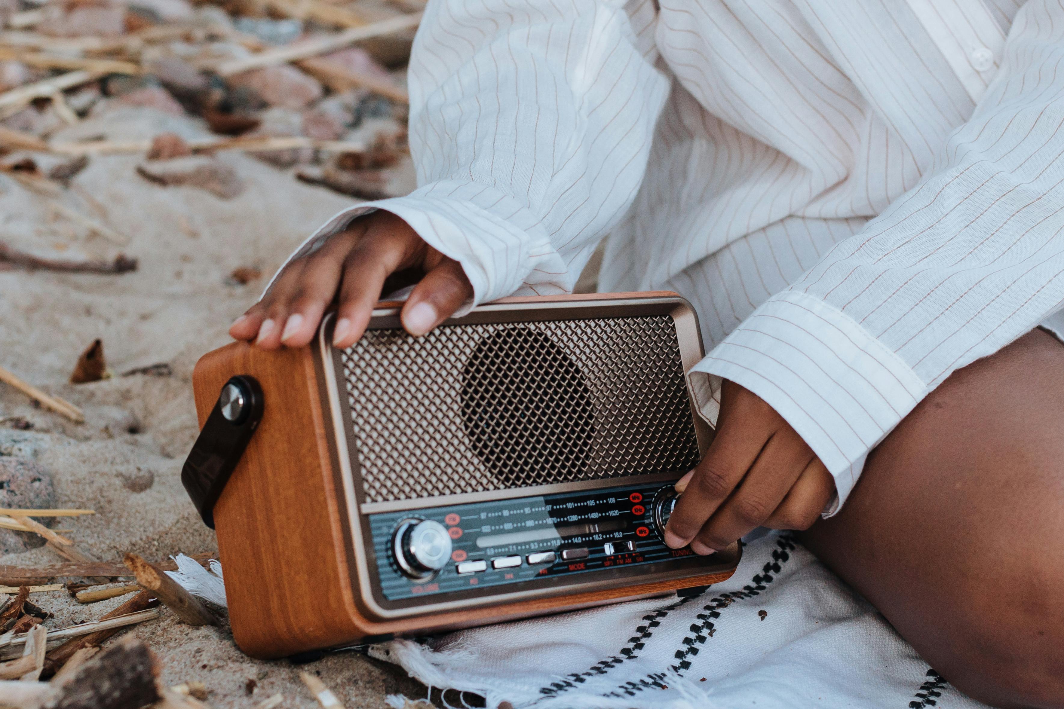 Female Hands Holding a Radio · Free Stock Photo