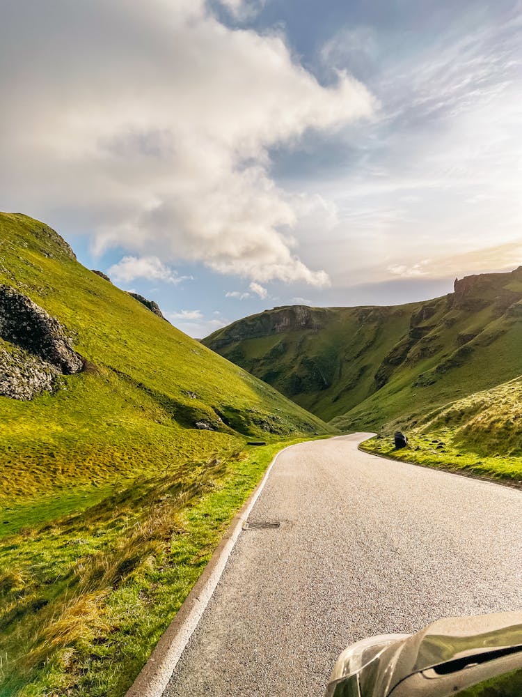 Road In The Middle Of Green Mountains