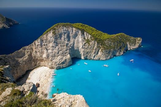 Stunning aerial view of Navagio Beach on Zakynthos Island, Greece, with azure waters and surrounding cliffs.
