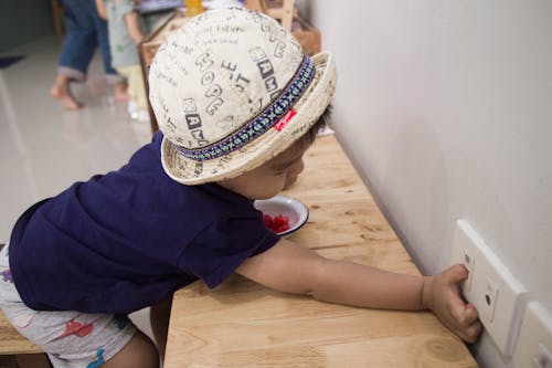 Boy Putting electric socket