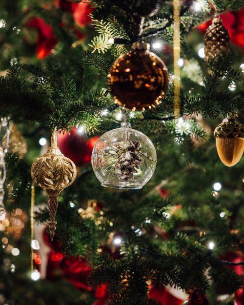 Free Decorative Christmas tree with glass ornaments and festive lights. Stock Photo