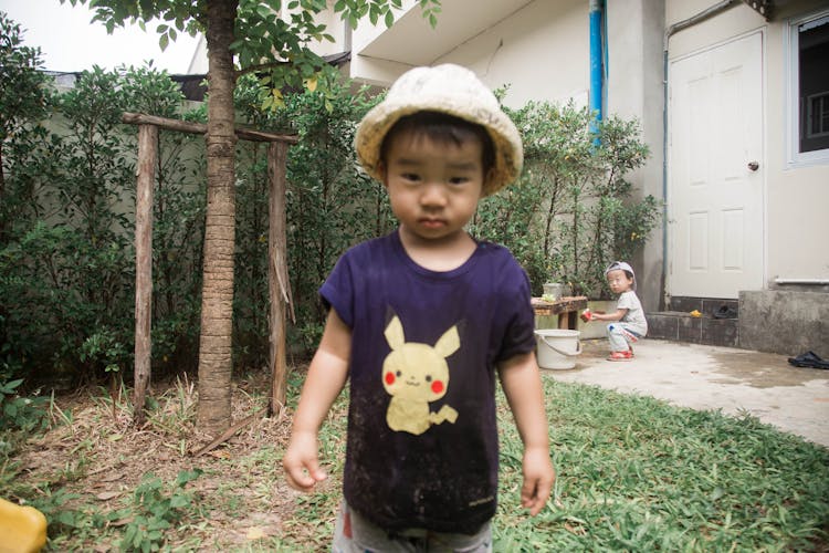 Boys Playing In Yard